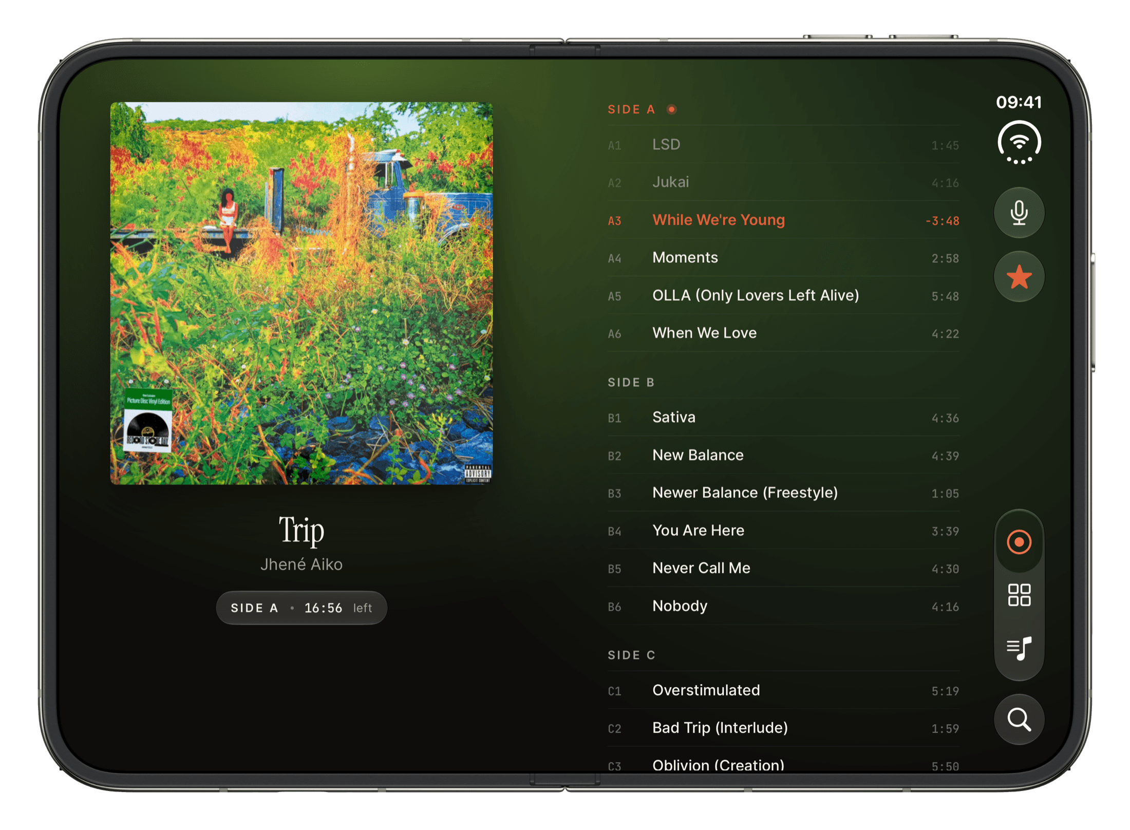 Analog on iPhone Duo, open: the record playing on one side and its full tracklist, side by side, on the other.