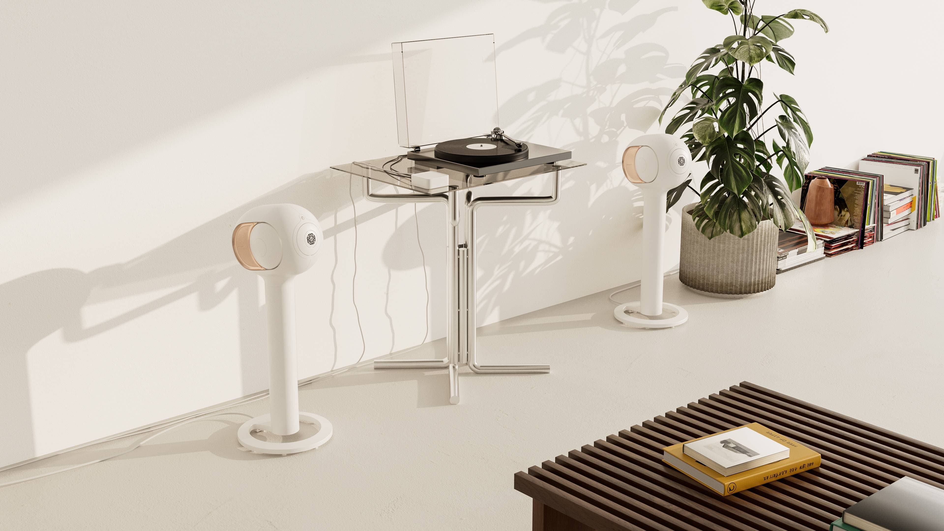 A turntable and Devialet Phantom speakers in a modern living room.