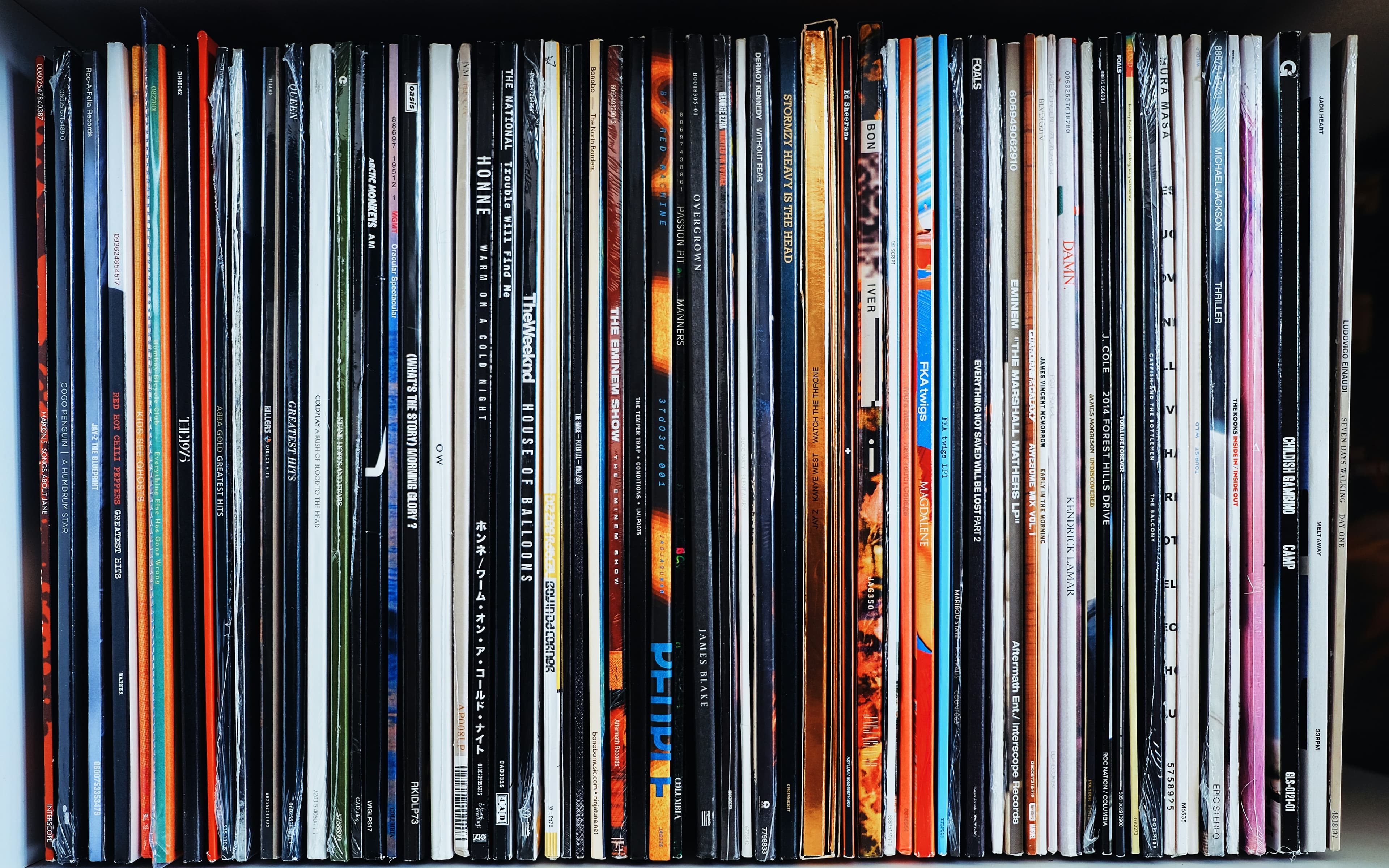 Records stored upright on a shelf, the way they stay flat and undamaged for decades.